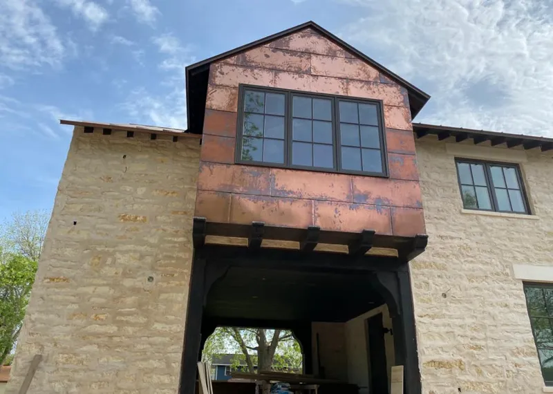 Copper metal panel facade on a stone building for Metal Roof Coating in Medulla