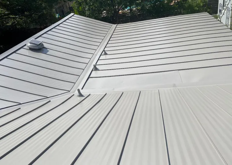 Solar attic fan installed on a metal roof for Roof Ventilation in Medulla